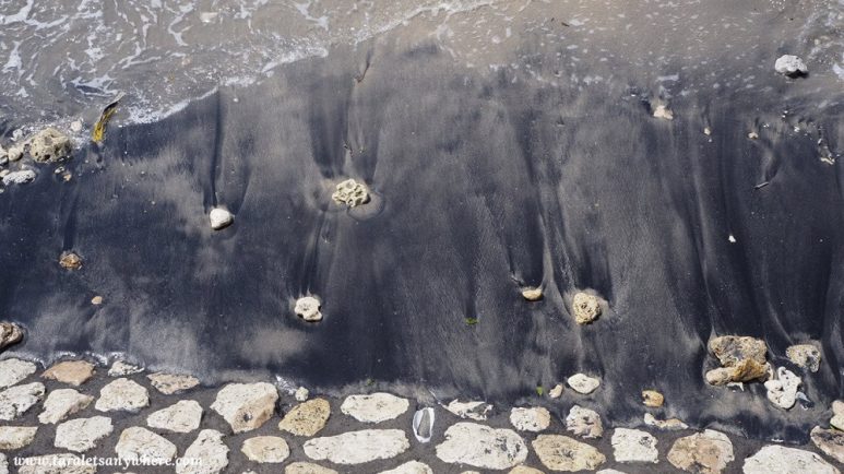 Random black-sand beach in Nusa Penida