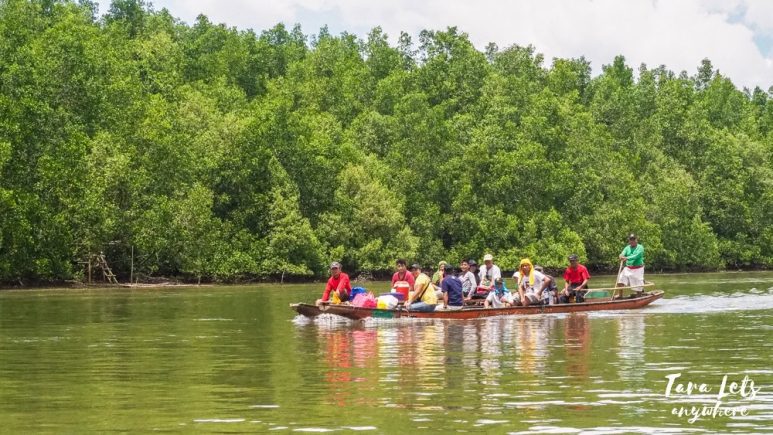 Locals on a boat in Kabug Island