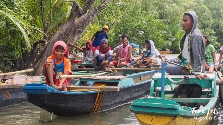 Locals on boats in the Siay wetlands