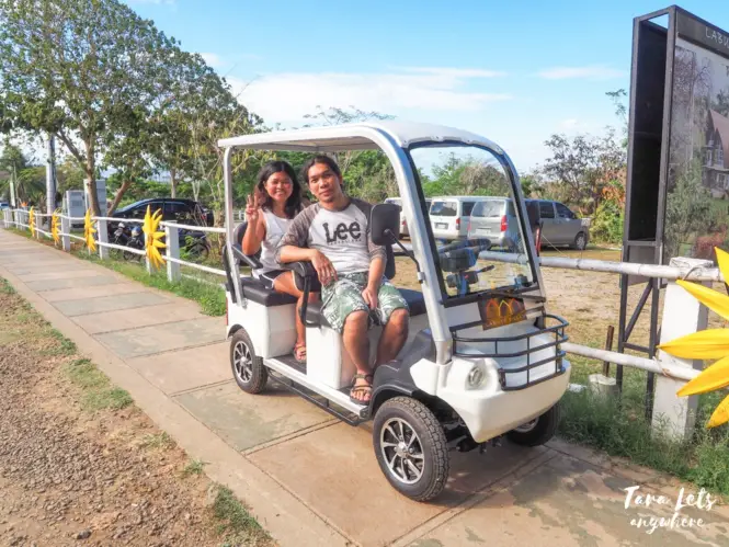 Couple shot in golf cart at Sinagtala Resort