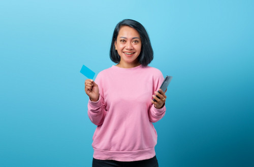 Asian woman with credit card