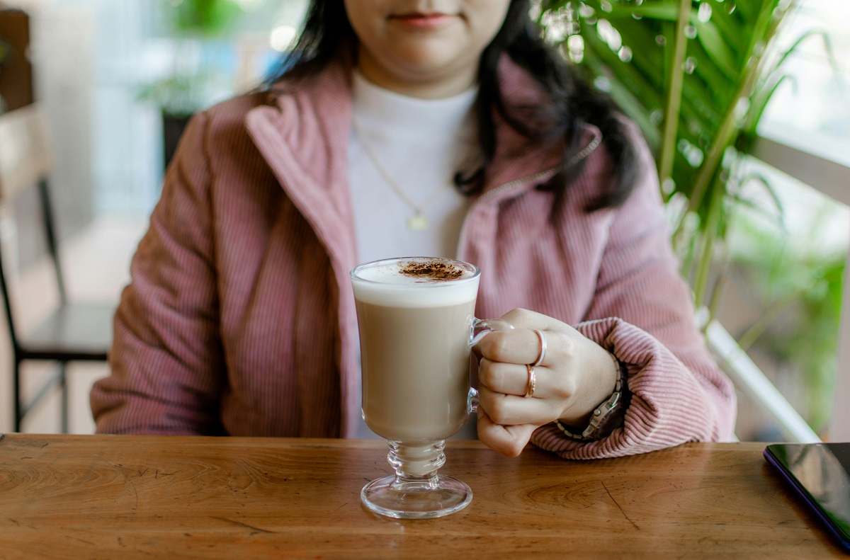 Asian woman having coffee