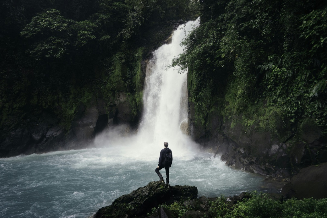 Man in a waterfall
