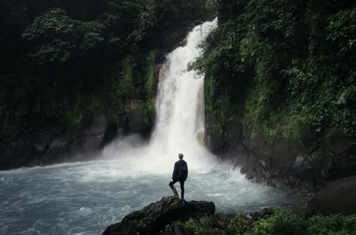 Man in a waterfall