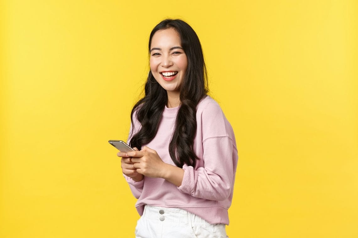 Asian woman holding a phone