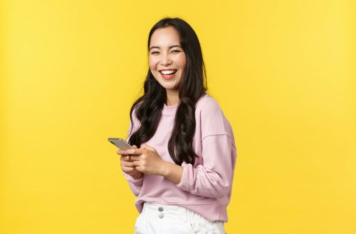 Asian woman holding a phone