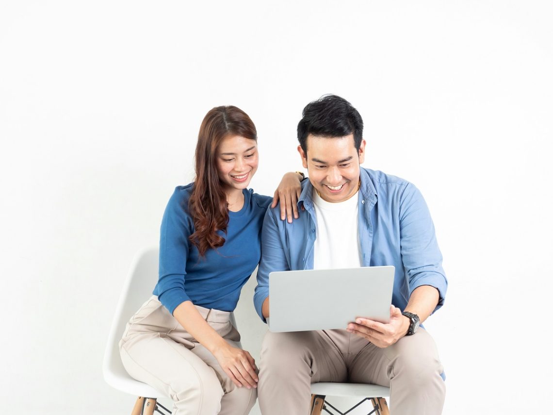 Asian couple on laptop