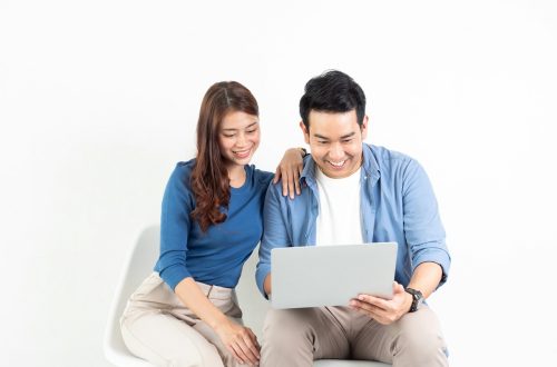 Asian couple on laptop