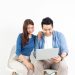 Asian couple with a laptop